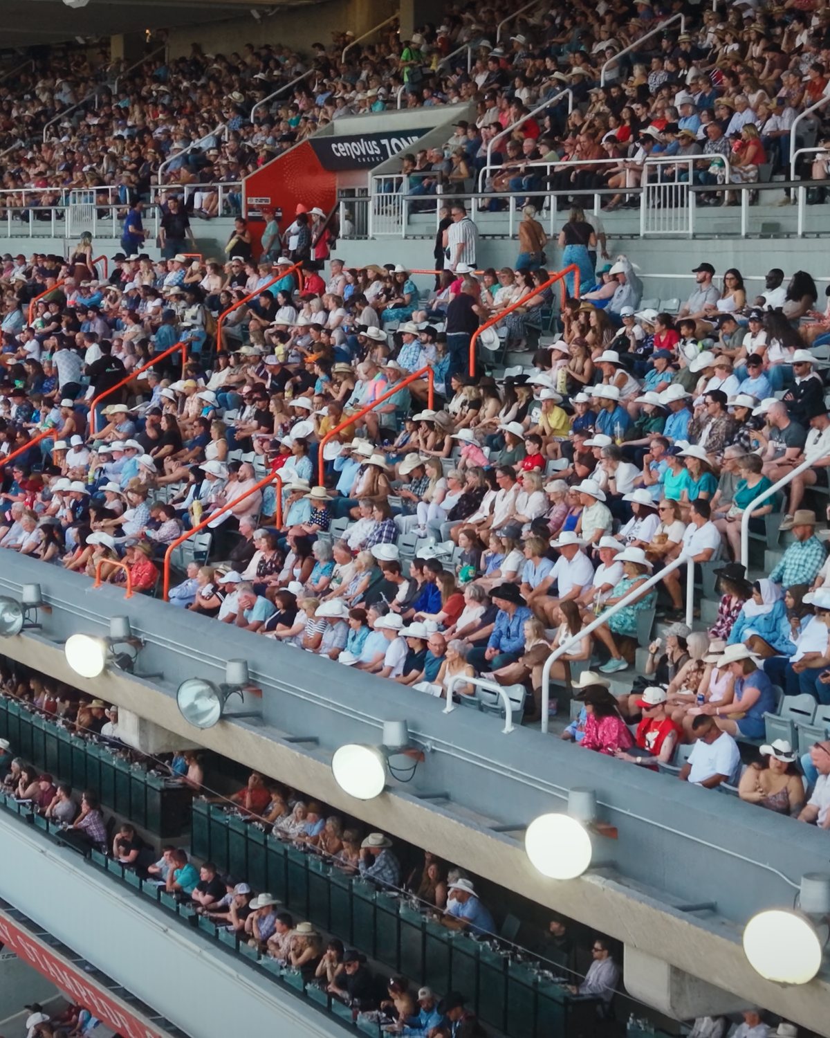 Packed grandstand crowd at the Calgary Stampede from the air