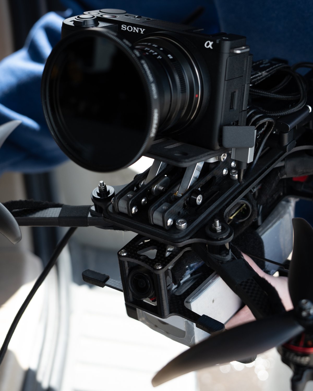 FPV cinelifter drone carrying a Sony cinema camera for a brand shoot